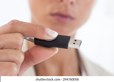 Woman Hand Holding USB Flash Drive 