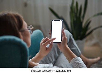 Woman hand holding using touch mobile phone white screen mockup Back view - Powered by Shutterstock