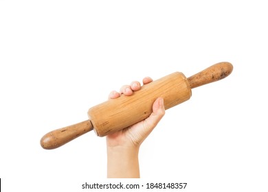 Woman hand holding a wooden rolling pin on a white background