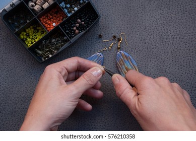 Woman hand making earrings polymer clay  Hobby  handicraft ba