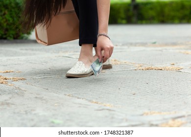 Woman Hand Money On The Ground In Street