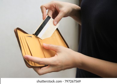 Woman Hand Open Leather Wallet Showing Credit Card