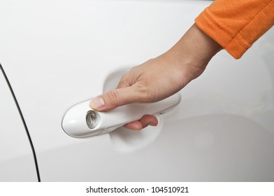 Woman hand open new white car door - Shutterstock ID 104510921