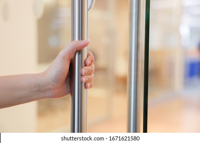 Woman Hand Open The Office Glass Door