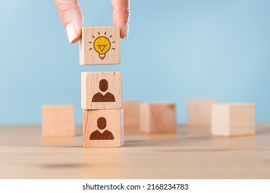 Woman Hand Picked Wooden Cube Block With Head Human Symbol And Light Bulb Icon. Creative Idea And Innovation. 