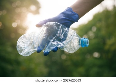 Woman Hand Picking Up Trash Plastic Bottle, Ecology Concept