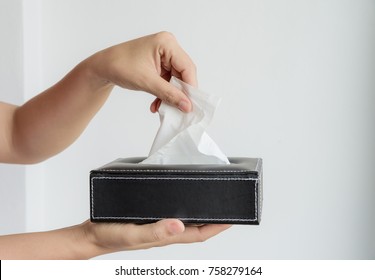 Woman Hand Picking White Tissue Paper From Tissue Box.