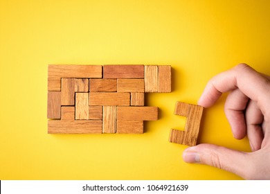 woman hand put wooden blocks arranging stacking for finishing task. Concept of solve problem and success plan
