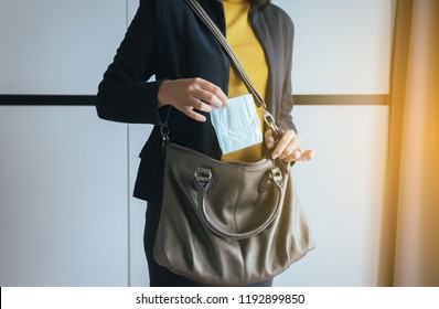 Woman Hand Putting Sanitary Napkin In Handbag,White Menstrual Pad,Menses