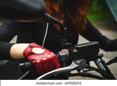 Woman Hand In Red Leather Glove Driving A Motorbike