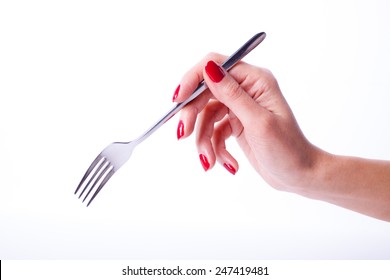 Woman Hand With Red Manicure Holding Fork