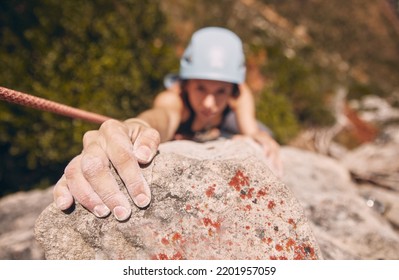 Woman, hand and rock climbing with rope on mountain, hill or remote hiking for workout, training and exercise. Fitness person in energy, risk and danger sports for wellness health in nature - Powered by Shutterstock