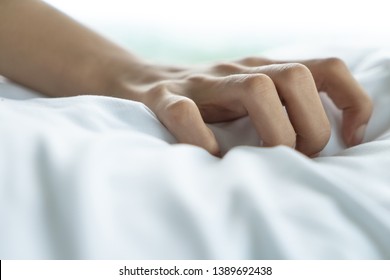 Woman Hand With Sex Orgasm On White Bed. 
Couple Lover Marriage Activity Lifestyle Pleasure Intimacy Moment.
Hand Sign Orgasm Girl Enjoying Sensual, Making Love, Having Sex Passion In Bed Room.