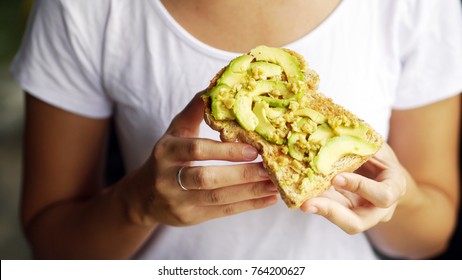 Woman Hand Show Eating Avocado Bread Cheese Toast White T-shirt Background