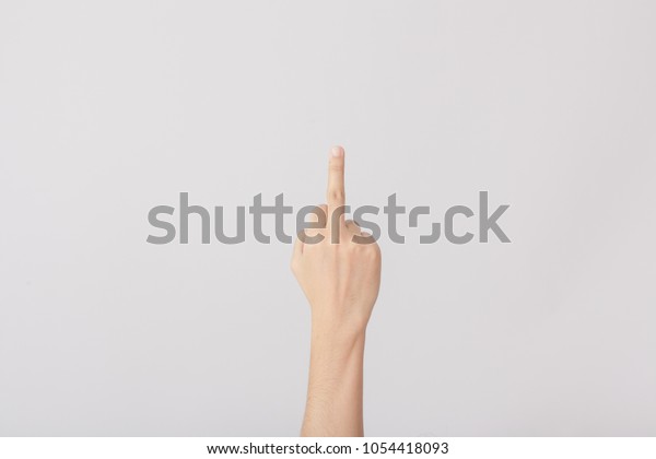 Woman hand\
show middle finger on white\
background.
