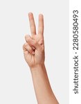 Woman hand showing Victory sign isolated, two fingers up