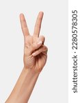 Woman hand showing Win sign isolated, two fingers up
