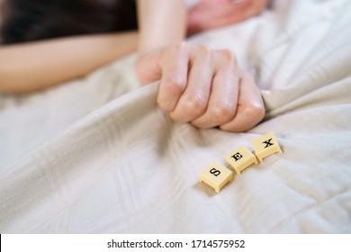 Woman Hand Sign Orgasm On Bed With Scrabble Board Showing Words Sex.