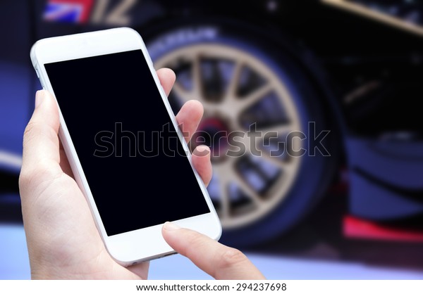 Woman hand with\
smartphone