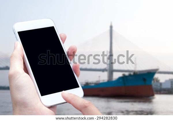 Woman hand with\
smartphone