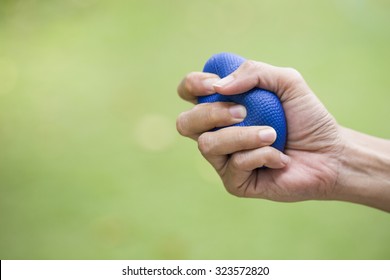 Woman Hand Squeezing A Stress Ball