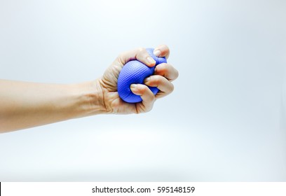 Woman Hand Squeezing A Stress Ball.