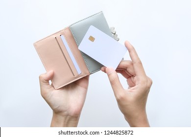 Woman Hand Take Out Showing Blank Card For Payment From Pink Wallet. Credit Debit Card With Chip