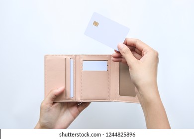 Woman Hand Take Out Showing Blank Card For Payment From Pink Wallet. Credit Debit Card With Chip