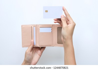 Woman Hand Take Out Showing Blank Card For Payment From Pink Wallet. Credit Debit Card With Chip