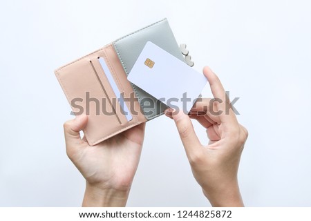 woman hand take out showing blank card for payment from pink wallet. Credit debit card with chip