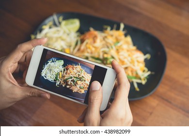 Woman Hand Taking Thai Food Photo By Mobile Phone. Food Photography. Share Food Photography. Popular Food Photo.