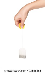 Woman Hand With Teabag Isolated On White Background