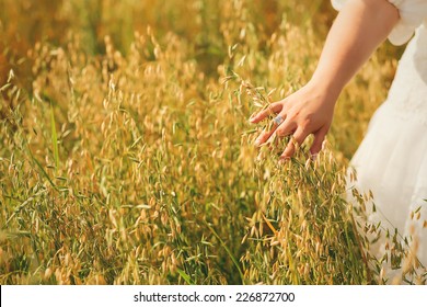 Woman Hand Touching Tall Summer Grass