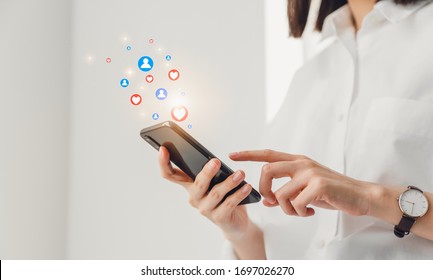 Woman Hand Typing Text Message On Online Social And Showing Icon On Screen.