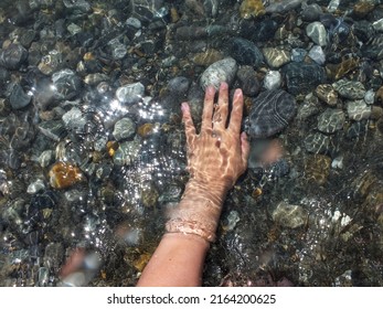 Woman Hand Under Sea Wave