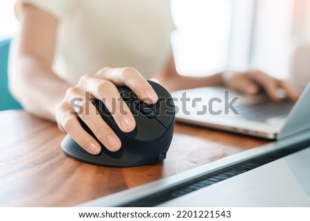 woman hand using computer ergonomic mouse, prevention wrist pain because working long time. De Quervain s tenosynovitis, Intersection Symptom, Carpal Tunnel Syndrome or Office syndrome concept