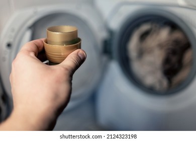 Woman Hand Using Liquid Laundry Softener Detergent Washing Cloth. Laundry Day