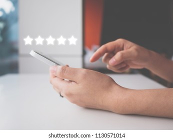 Woman Hand Using Smart Phone With Icon Five Star Symbol To Increase Rating Of Company Concept