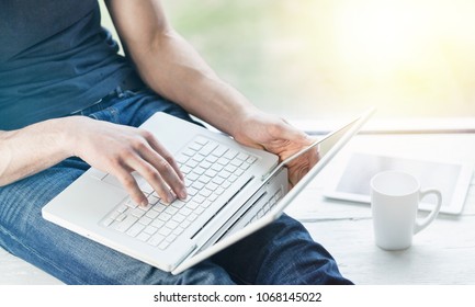 Woman hand works in a laptop computer