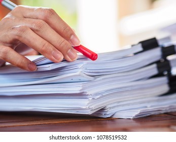 woman hand writing on stack of paper. business and education  concept - Shutterstock ID 1078519532
