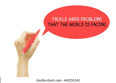 Woman Hand Writing TACKLE HARD PROBLEMS THAT THE WORLD IS FACING Message With A Marker Isolated On White.