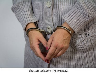 Woman With Handcuffs In Front Of Her. Arrested For Murder