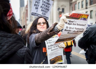 Woman Handing Out Flyers Promoting Revolution On Humanity To A Crowd During The NYC Women's March - New York, NY, USA January 1/19/2019 Women's March