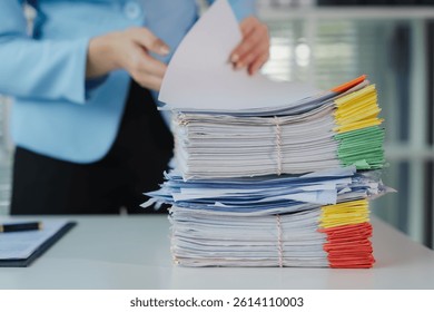 Woman Handling Stack of Documents