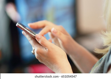 woman hands close up holding smartphone touch screen