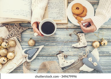 Woman hands with cookies and cup of hot coffee - Powered by Shutterstock