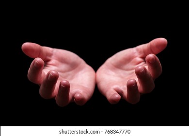 Woman hands cupped in a welcoming, accepting, offering, giving, begging, receiving gesture. Also for praying, prayer, welcome, accept, give, receive, protect, concept. Black background, front view