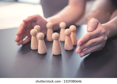 Woman hands defending his team with a gesture of protection, Security and safety in a business team.