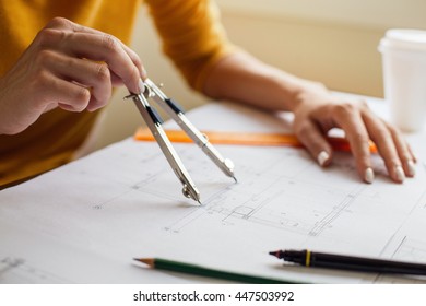 Woman hands doing technical drawing