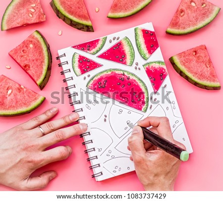 woman hands drawing a watermelon pattern sketch on pink background with markers. bright food sketch decorated with watermelon pieces